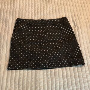 Polka dot denim skirt.